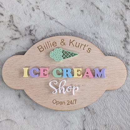 Custom Wooden sign for 'pretend play kitchen Ice Cream Shop' on a marble surface