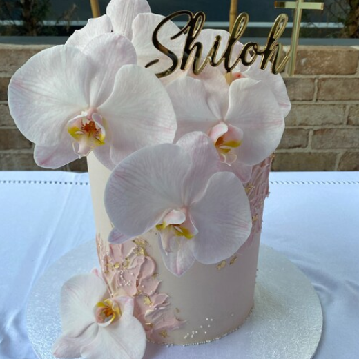 Christening cake topper decoration in a gold