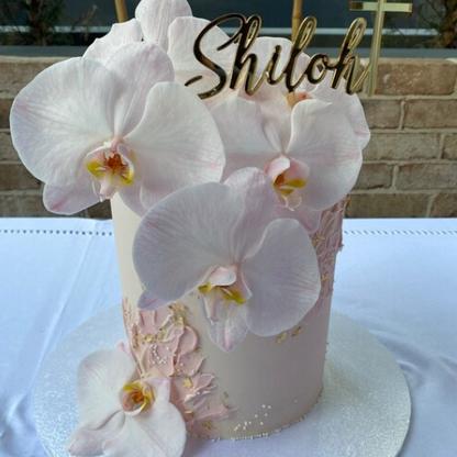 Christening cake topper decoration in a gold