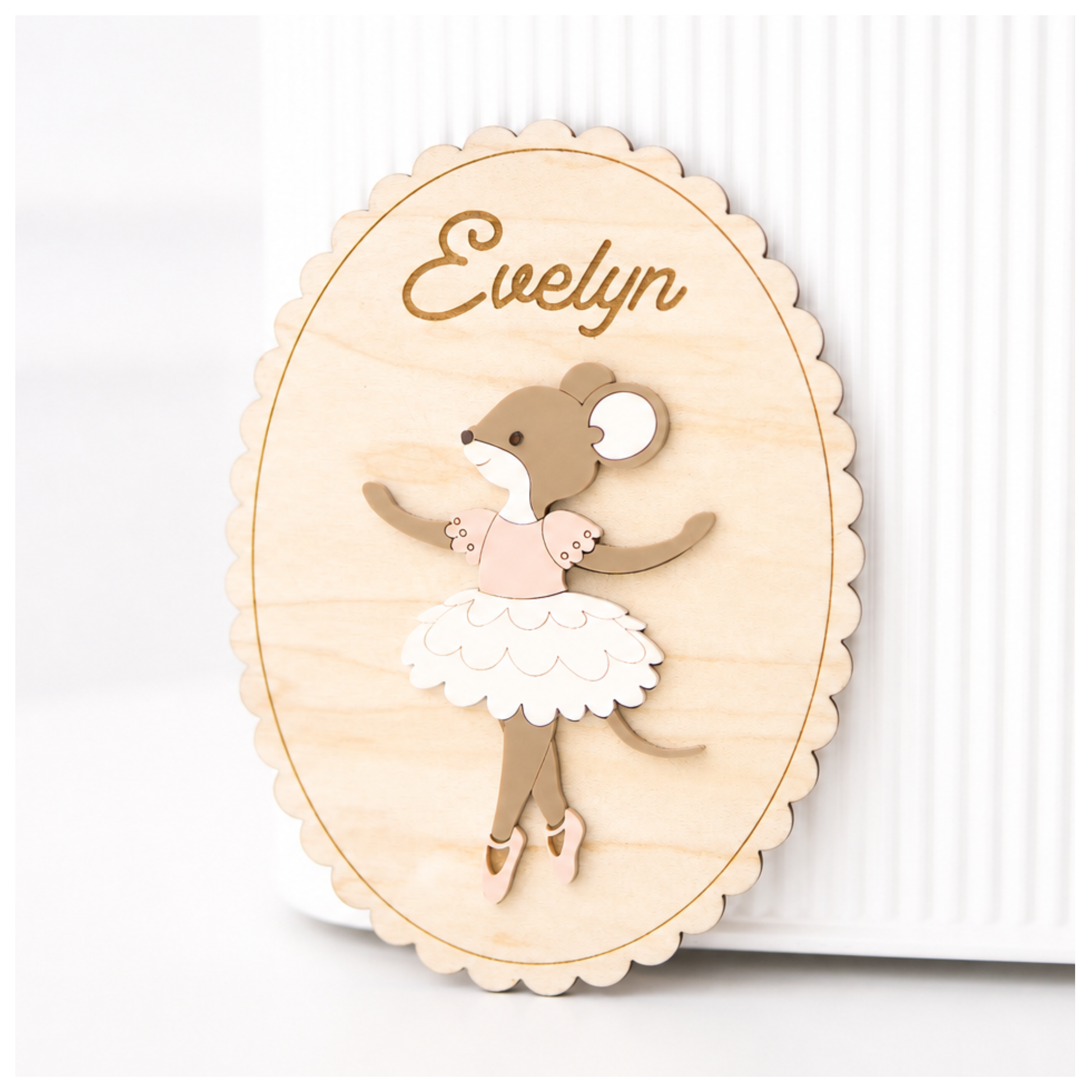 Wooden name plaque with a ballerina design and the name 'Evelyn' on a white background