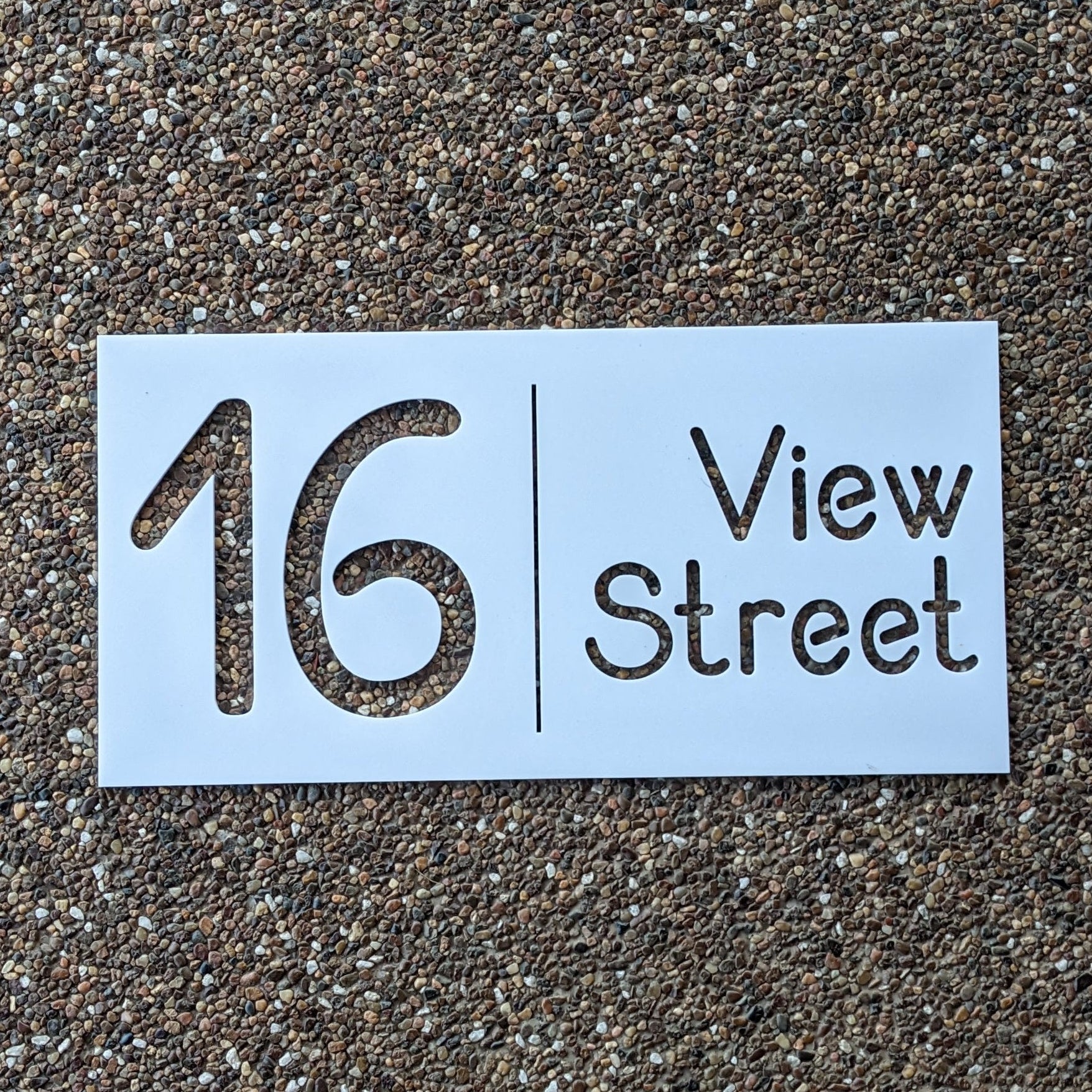 Street address sign on a textured surface